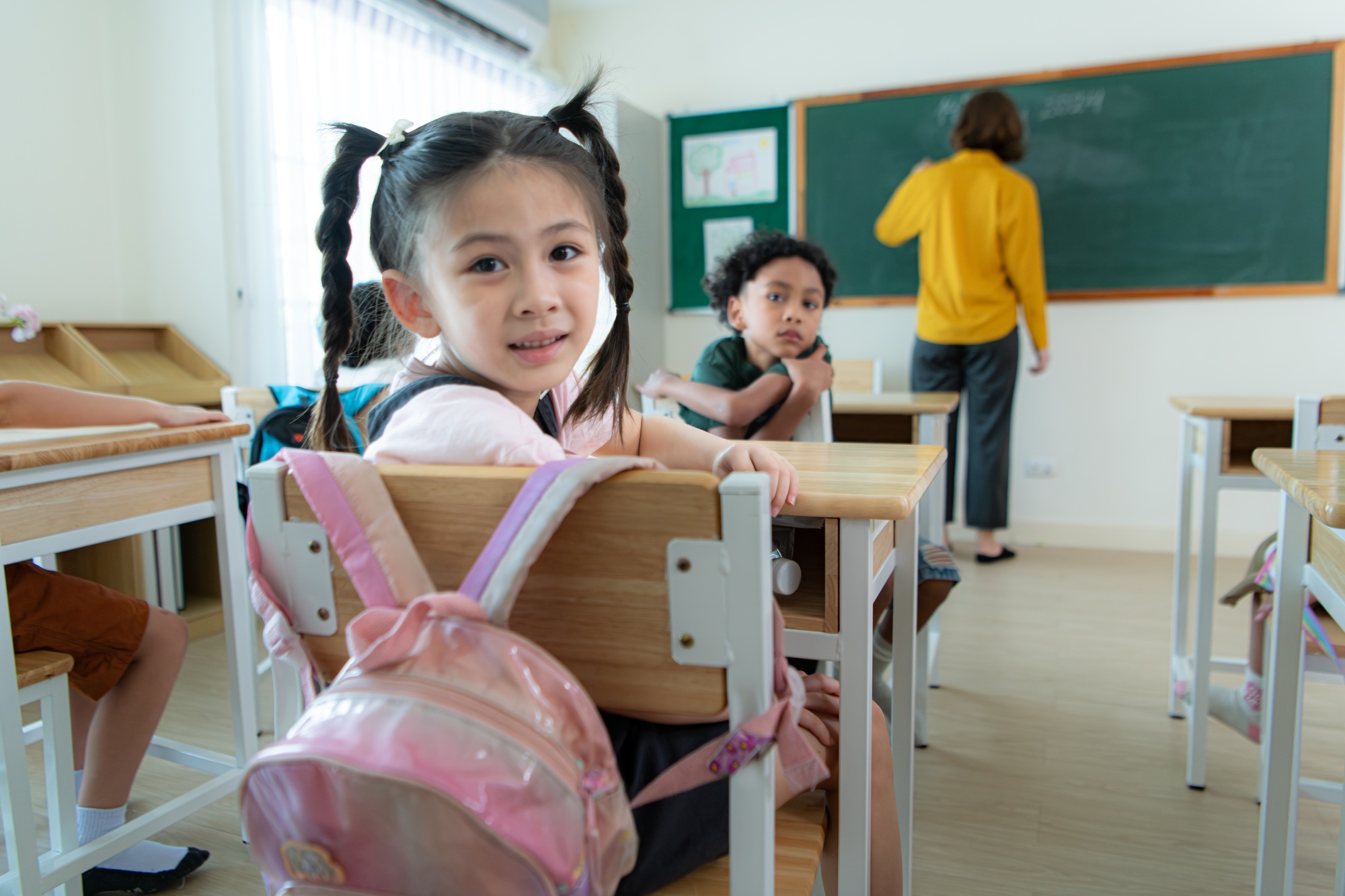 A schoolchild with his rucksack to store vital stuff for class.