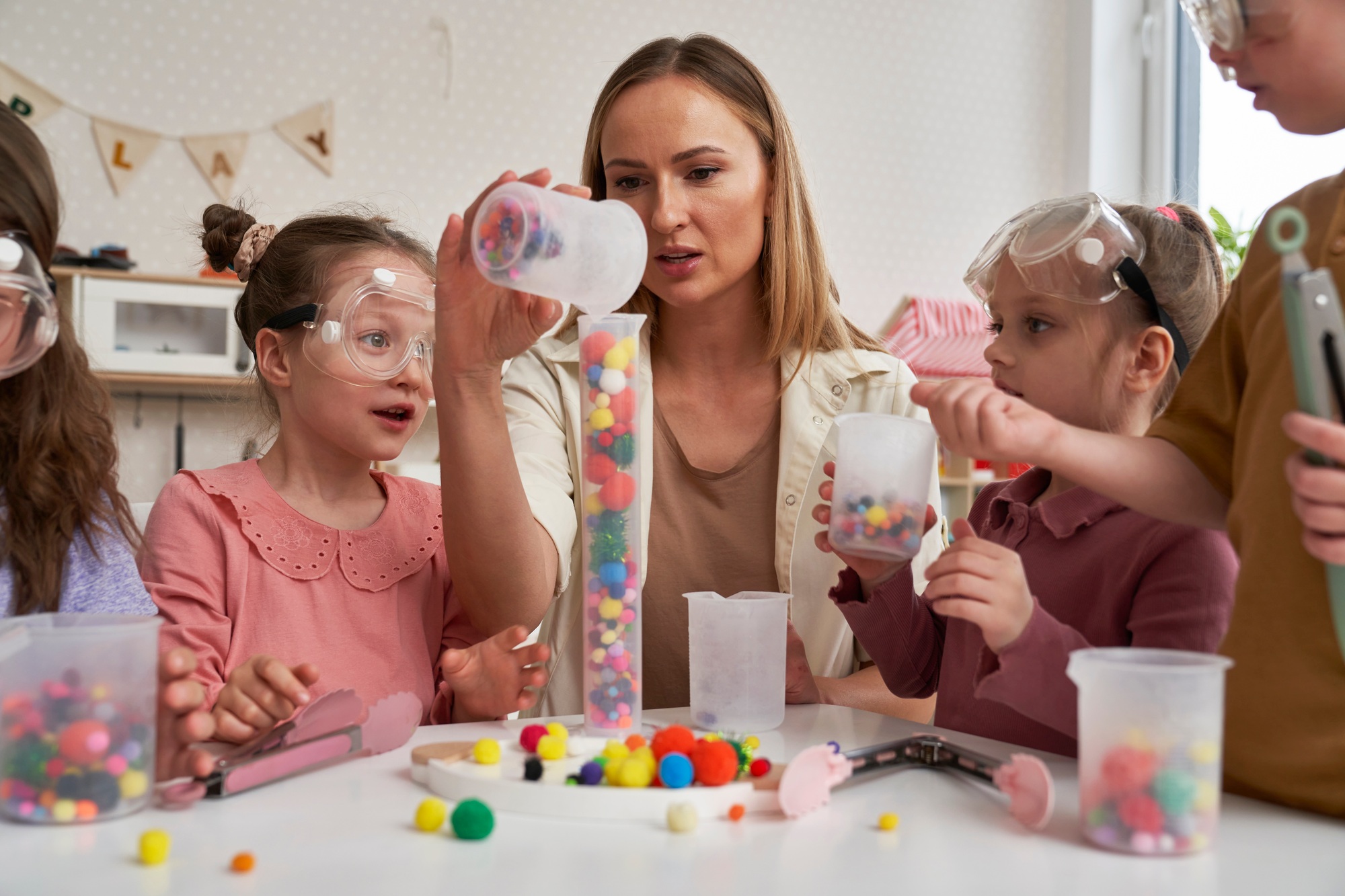 Children and teacher having science sensory exercises